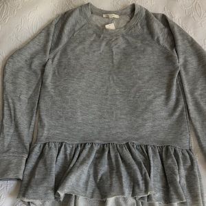 Grey peplum sweatshirt from Anthropologie
